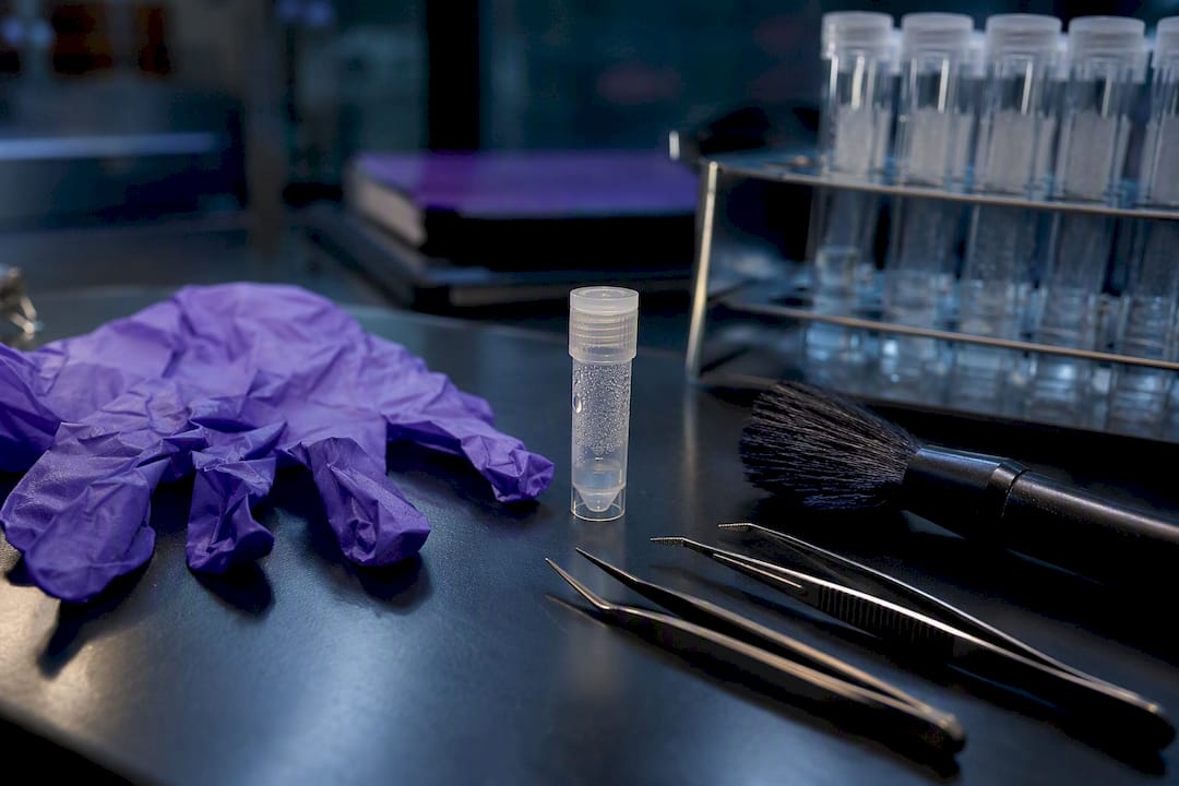 Forensic lab tools and DNA sample vial