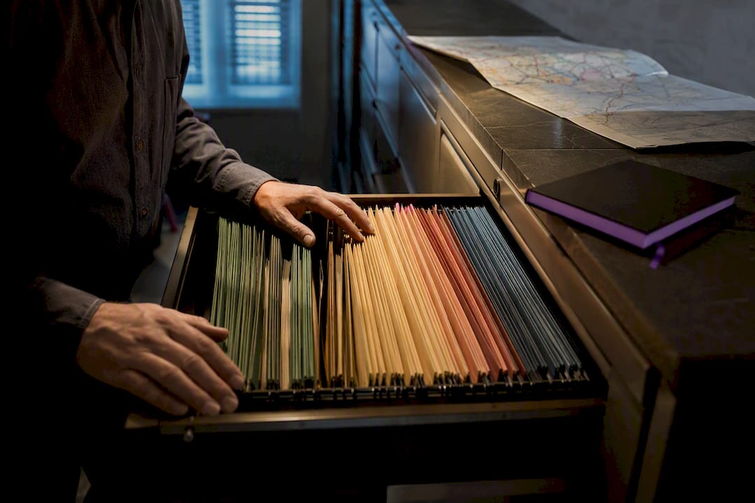 Researcher examining state cold case records